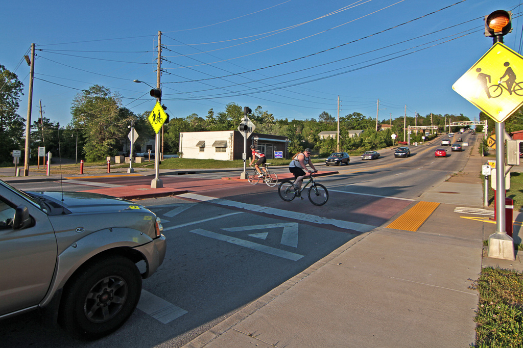 Bikers crossing road.